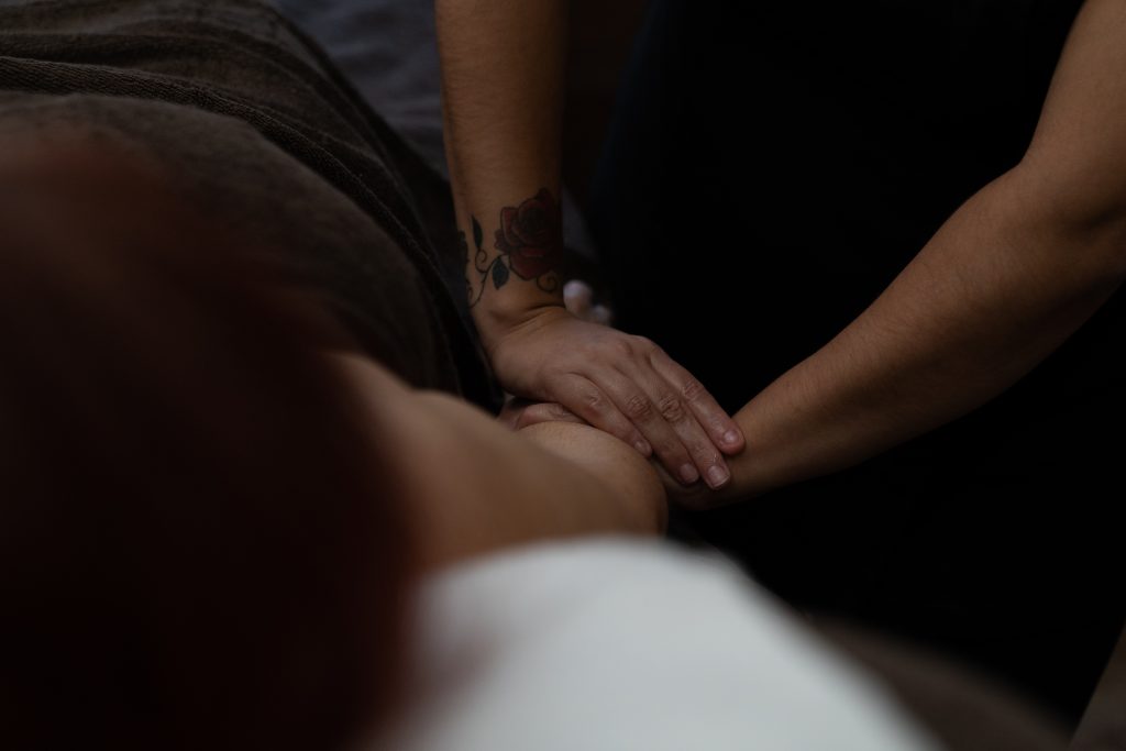 Client receiving sports massage for back tension at Ana Harmony in Maidenhead