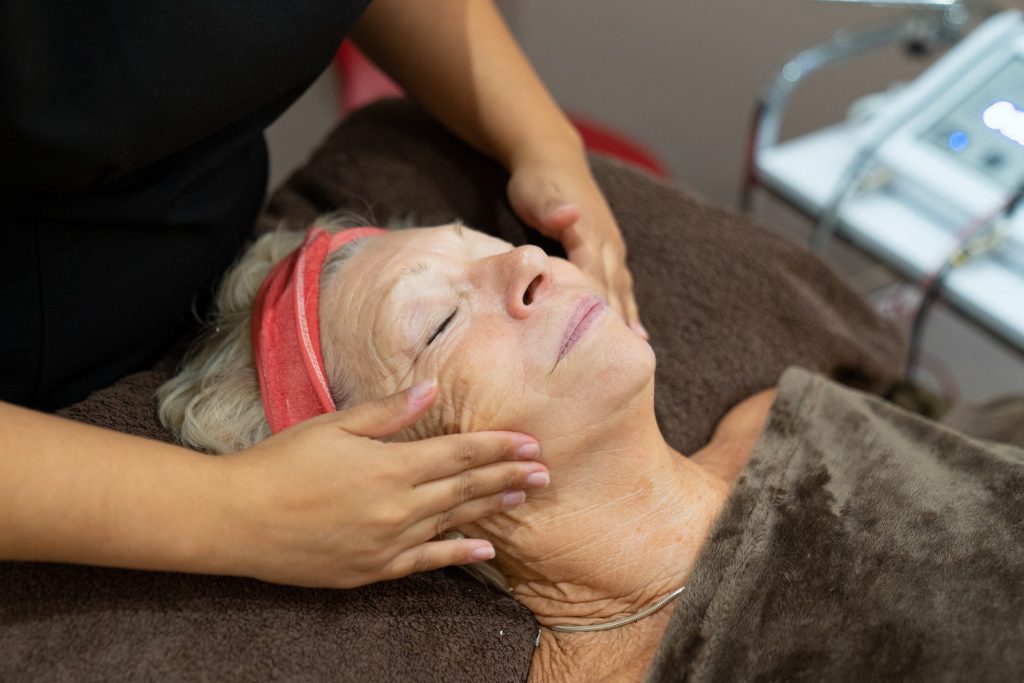 Client enjoying a summer facial treatment in Maidenhead at Ana Harmony